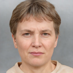 Joyful white adult male with short  brown hair and grey eyes