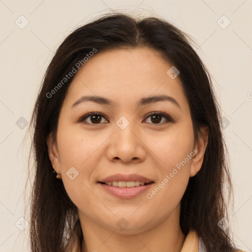 Joyful latino young-adult female with long  brown hair and brown eyes