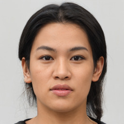 Joyful asian young-adult female with medium  brown hair and brown eyes