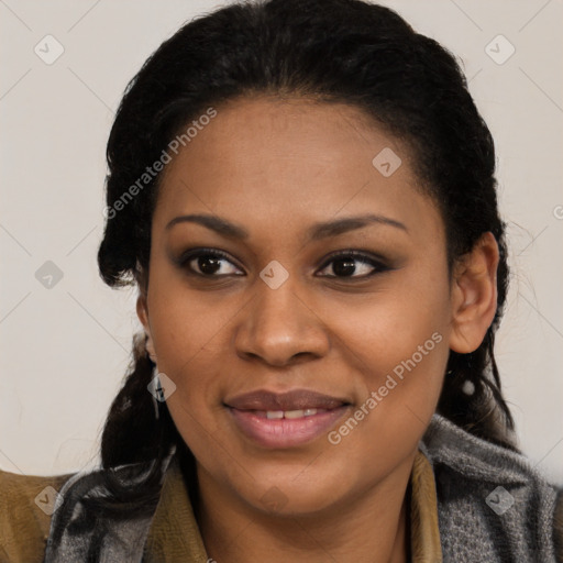 Joyful black young-adult female with long  black hair and brown eyes