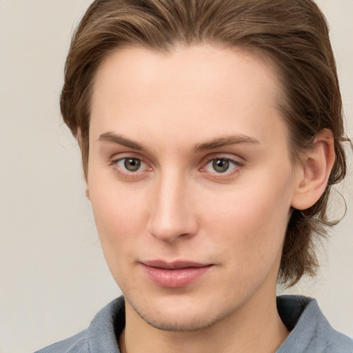 Joyful white young-adult female with medium  brown hair and grey eyes