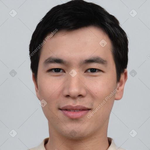 Joyful asian young-adult male with short  black hair and brown eyes