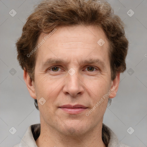 Joyful white adult male with short  brown hair and grey eyes