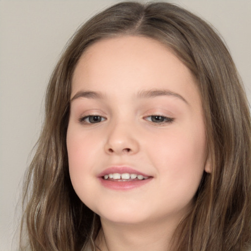 Joyful white child female with long  brown hair and brown eyes