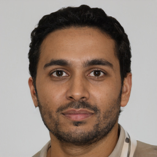 Neutral latino young-adult male with short  black hair and brown eyes