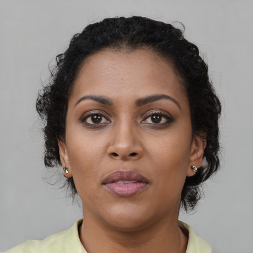 Neutral black young-adult female with short  brown hair and brown eyes