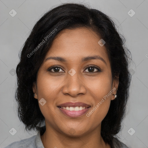 Joyful latino young-adult female with medium  brown hair and brown eyes