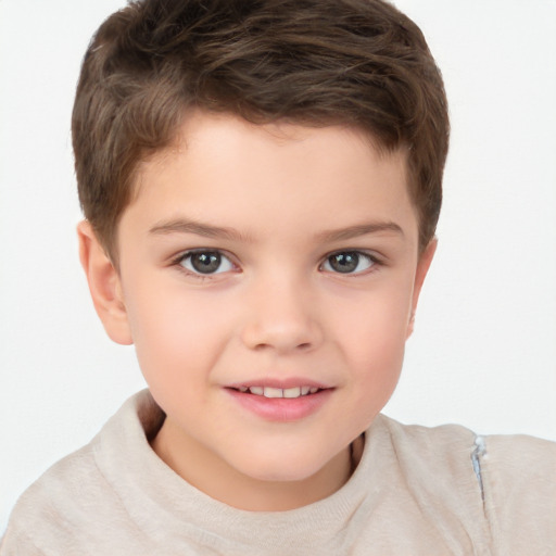 Joyful white child male with short  brown hair and brown eyes