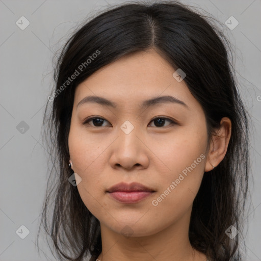 Joyful asian young-adult female with long  brown hair and brown eyes