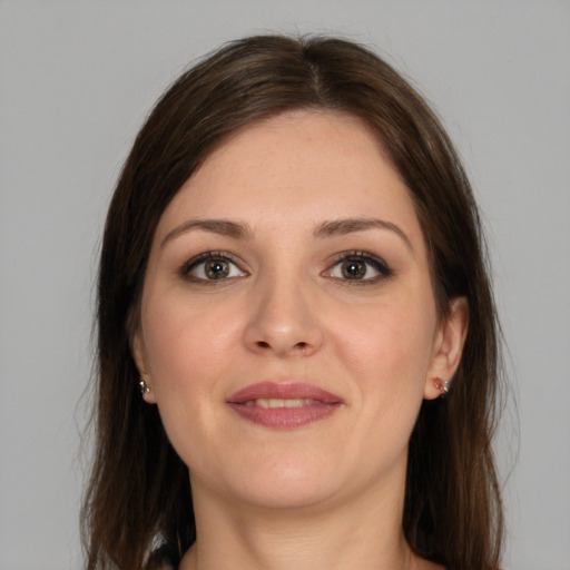 Joyful white young-adult female with medium  brown hair and brown eyes