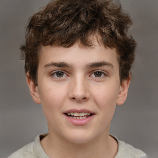 Joyful white child male with short  brown hair and brown eyes