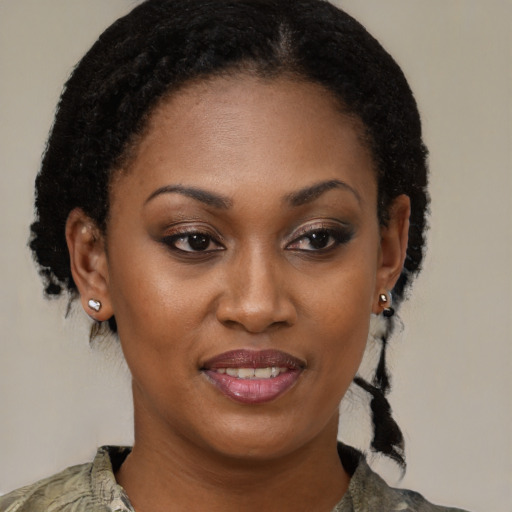 Joyful black young-adult female with medium  brown hair and brown eyes