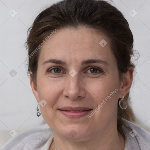 Joyful white adult female with short  brown hair and grey eyes