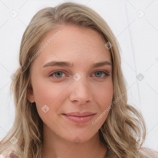 Joyful white young-adult female with long  brown hair and blue eyes