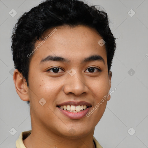 Joyful latino young-adult male with short  brown hair and brown eyes