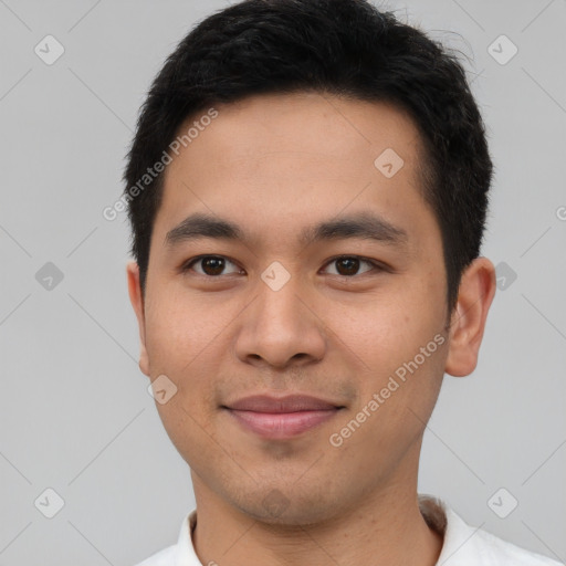 Joyful asian young-adult male with short  black hair and brown eyes