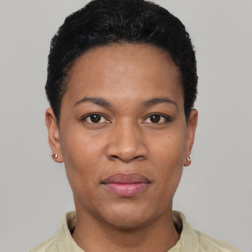 Joyful latino young-adult female with short  black hair and brown eyes