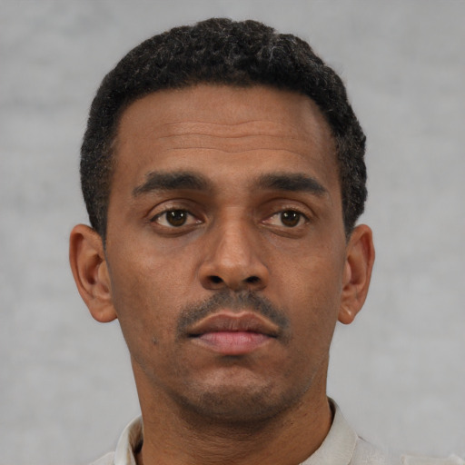 Neutral latino young-adult male with short  brown hair and brown eyes