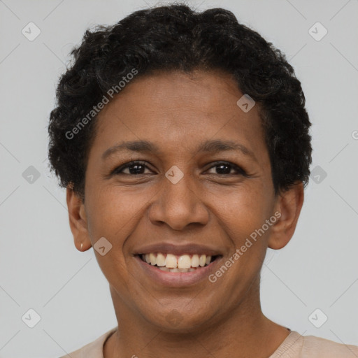 Joyful black young-adult female with short  brown hair and brown eyes