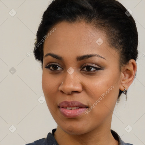 Joyful black young-adult female with short  brown hair and brown eyes