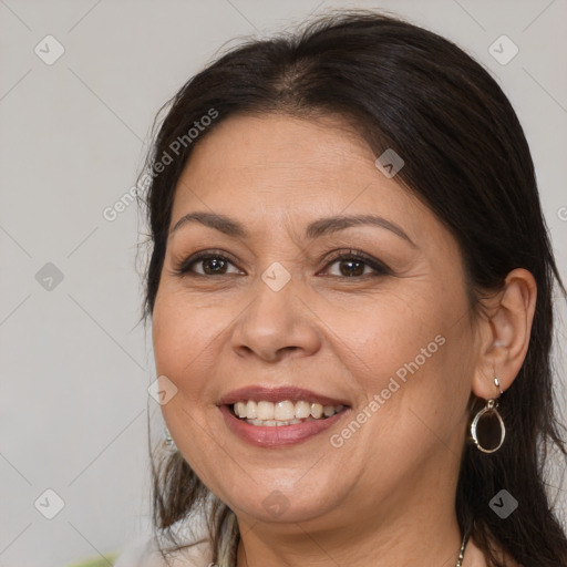 Joyful white adult female with medium  brown hair and brown eyes