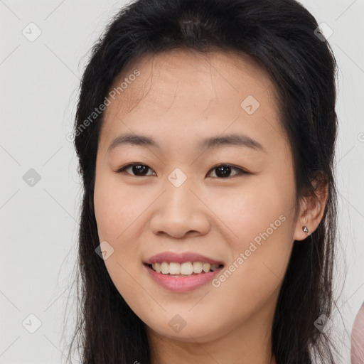 Joyful white young-adult female with long  brown hair and brown eyes