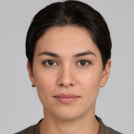 Neutral white young-adult female with short  brown hair and brown eyes