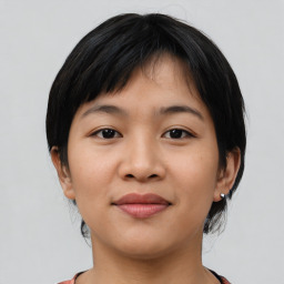 Joyful asian young-adult female with medium  black hair and brown eyes