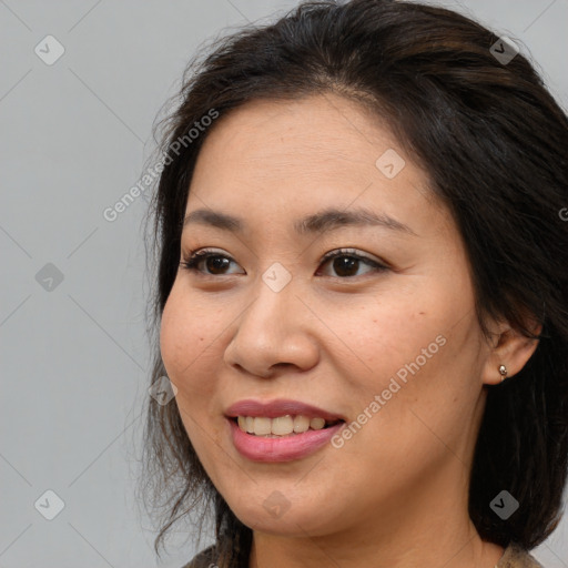 Joyful white adult female with medium  brown hair and brown eyes