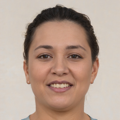 Joyful white young-adult female with short  brown hair and brown eyes
