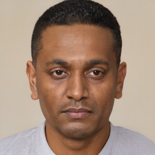 Neutral black young-adult male with short  black hair and brown eyes