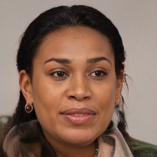 Joyful black young-adult female with medium  brown hair and brown eyes