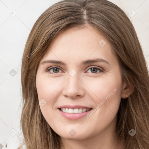 Joyful white young-adult female with long  brown hair and grey eyes