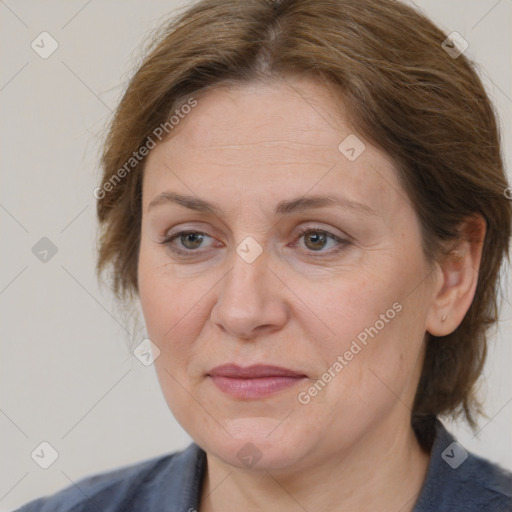 Joyful white adult female with medium  brown hair and grey eyes