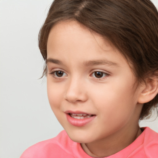 Joyful white child female with medium  brown hair and brown eyes