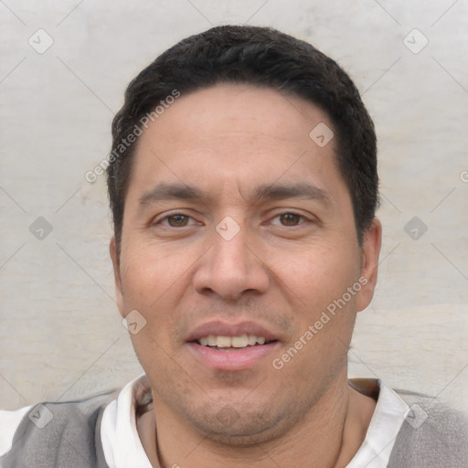 Joyful white adult male with short  black hair and brown eyes