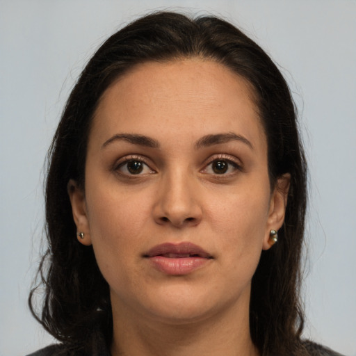 Joyful white young-adult female with long  brown hair and brown eyes