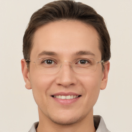 Joyful white young-adult male with short  brown hair and grey eyes