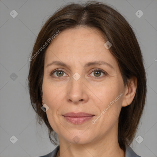 Joyful white adult female with medium  brown hair and brown eyes