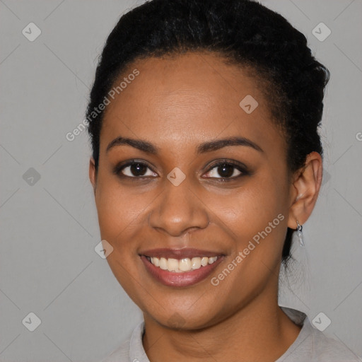 Joyful latino young-adult female with short  black hair and brown eyes