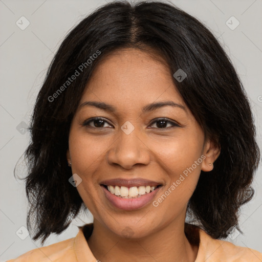 Joyful latino young-adult female with medium  brown hair and brown eyes