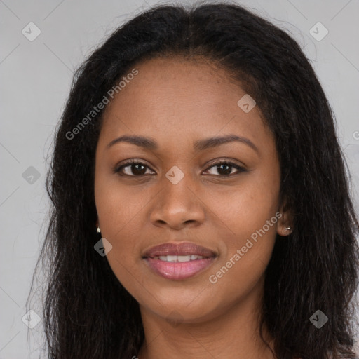 Joyful black young-adult female with long  brown hair and brown eyes