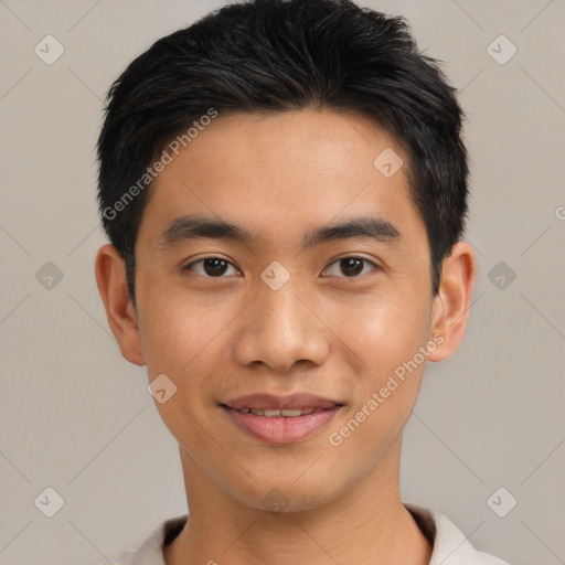 Joyful asian young-adult male with short  black hair and brown eyes