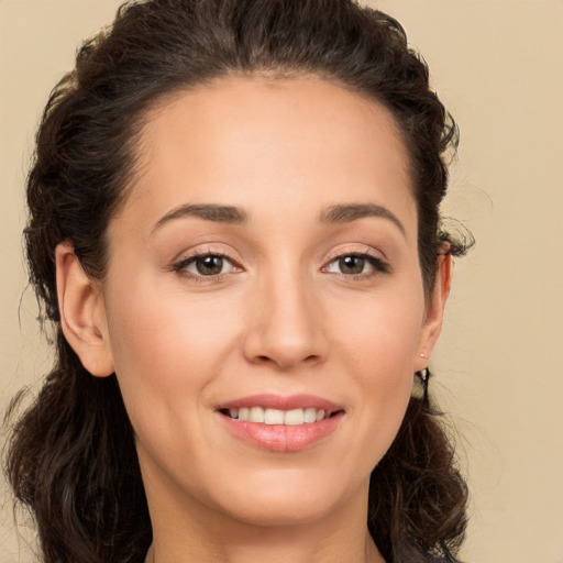 Joyful white young-adult female with long  brown hair and brown eyes