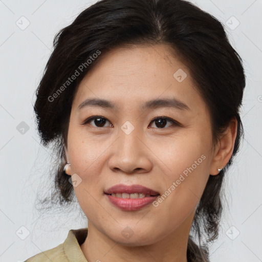 Joyful asian adult female with medium  brown hair and brown eyes