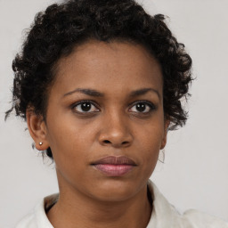 Neutral black young-adult female with short  brown hair and brown eyes