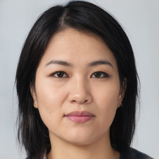 Neutral asian young-adult female with medium  brown hair and brown eyes