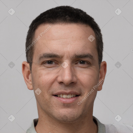 Joyful white adult male with short  brown hair and brown eyes