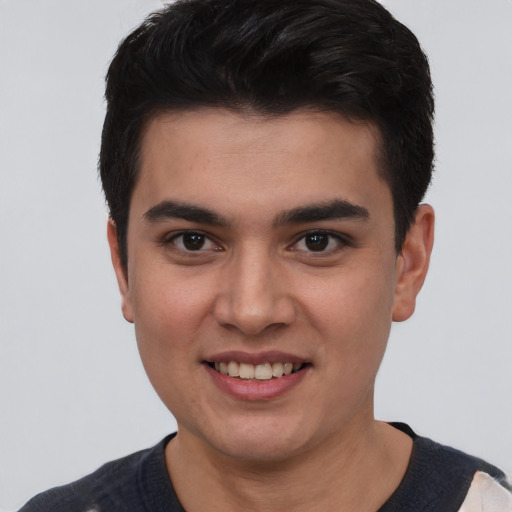 Joyful white young-adult male with short  black hair and brown eyes