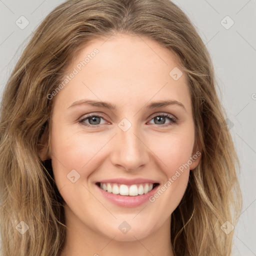 Joyful white young-adult female with long  brown hair and green eyes